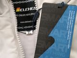 an image of a close up of a white jacket with a name tag on it