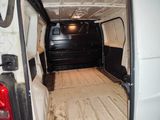 a white van with a flat bed in the back of it