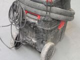 a dirty machine that is sitting on the floor
