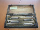 a wooden box with a bunch of tools inside of it
