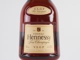 a bottle of hennessy brandy on a white background