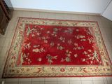 rug on the floor of a kitchen with a stove and dishwasher