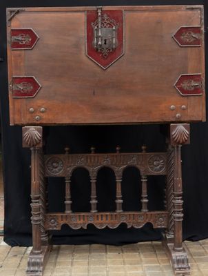 a wooden table with a red and white design on it