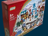 une boîte contenant un village de Noël en Lego