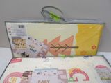 a box with a baby shower set in it on a table