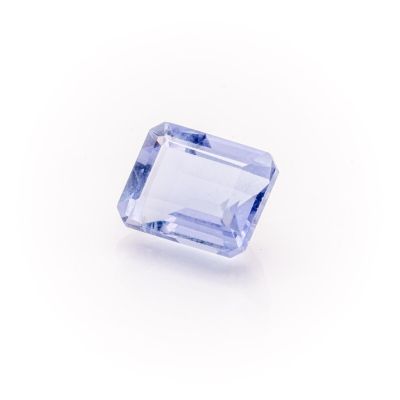 a blue sapphire stone on a white background