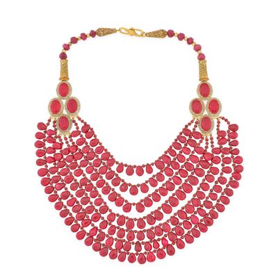 a close up of a necklace with red beads on a white background