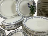a lot of plates that are stacked together on the table