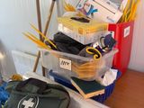 a pile of office supplies sitting on a desk next to a bag