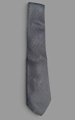 the tie is gray and has a black stripe on it