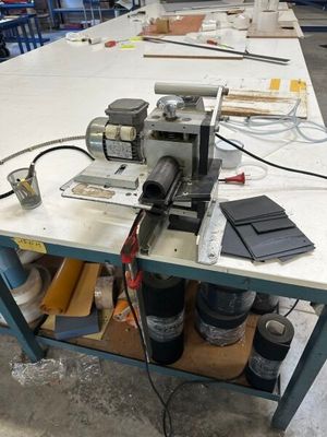 a machine that is sitting on a table in a factory