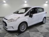 the white ford c - max is parked on a checkered floor