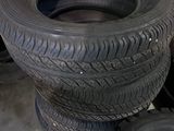several tires stacked on top of each other in a garage