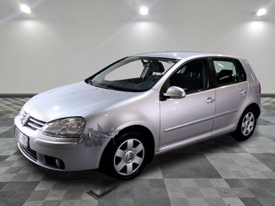 a picture of a silver car parked on a checkered floor
