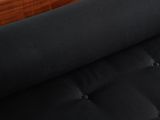 the black fabric is rolled up on the wooden frame of the bed