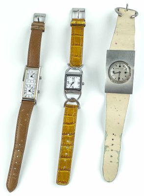 trois types de montres sont présentés sur une surface blanche