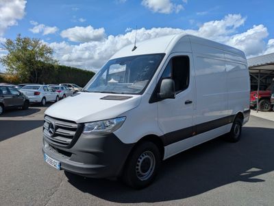 the white van is parked in the parking lot near many cars