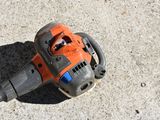 a chainsaw that is laying on the ground