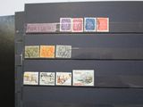 a black refrigerator with stamps on it in a room