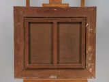 an old wooden easel with a painting on top of it