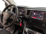 the interior of a car with a steering wheel and dashboard controls