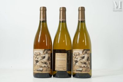 three bottles of wine sitting next to each other on a table