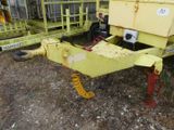 a yellow trailer that is parked in the dirt