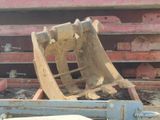 a bulldozer sitting in the back of a truck