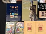 a lot of books that are sitting on a table