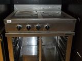 a stainless steel stove with two burners in a kitchen