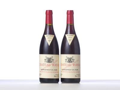 two bottles of red wine sitting next to each other on a table