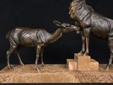 bronze sculpture of a deer and a baby deer on a marble base