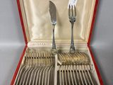 a red case with silverware in it on a table