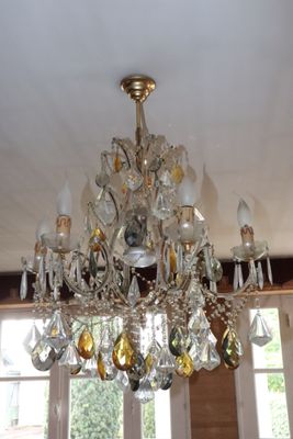 a chandelier that is hanging from the ceiling in the room