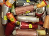 many spools of thread in a box
