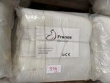 several packages of mattresses stacked on top of each other in a warehouse