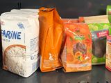 many bags of food on the shelf in the refrigerator