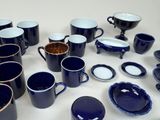 a lot of cups and saucers on the table