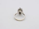 a close up of a ring on a white surface
