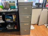 a file cabinet with a lot of files on it