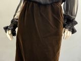 an image of a mannequin wearing a brown skirt and black blouse