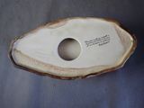 a white vase with a quote on it on a table