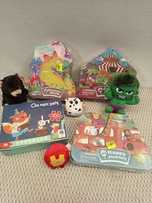 a lot of toys and books on the floor