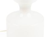 a white glass table lamp with a gold metal base