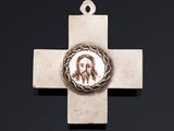 a cross with a picture of jesus on it on a black background