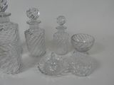 a lot of glass items that are sitting on a table