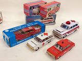 five toy cars and a box of other toy vehicles