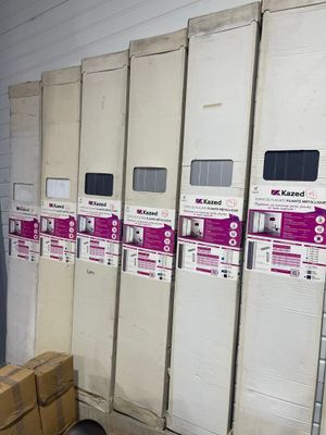 boxes and boxes are stacked on the floor in a storage room