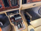 a dashboard of a car with a clock and other items in it