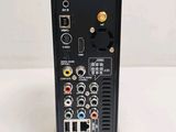 a close up of a remote control unit on a white surface